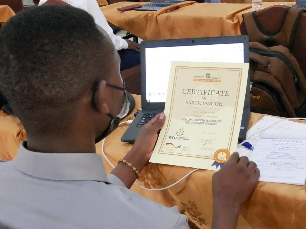 Man looking at his certificate